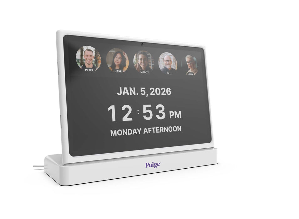 Paige™ Video Communication Frame for Home Care displays five photos with names underneath.  The date and time are also shown in white on the black screen background. 